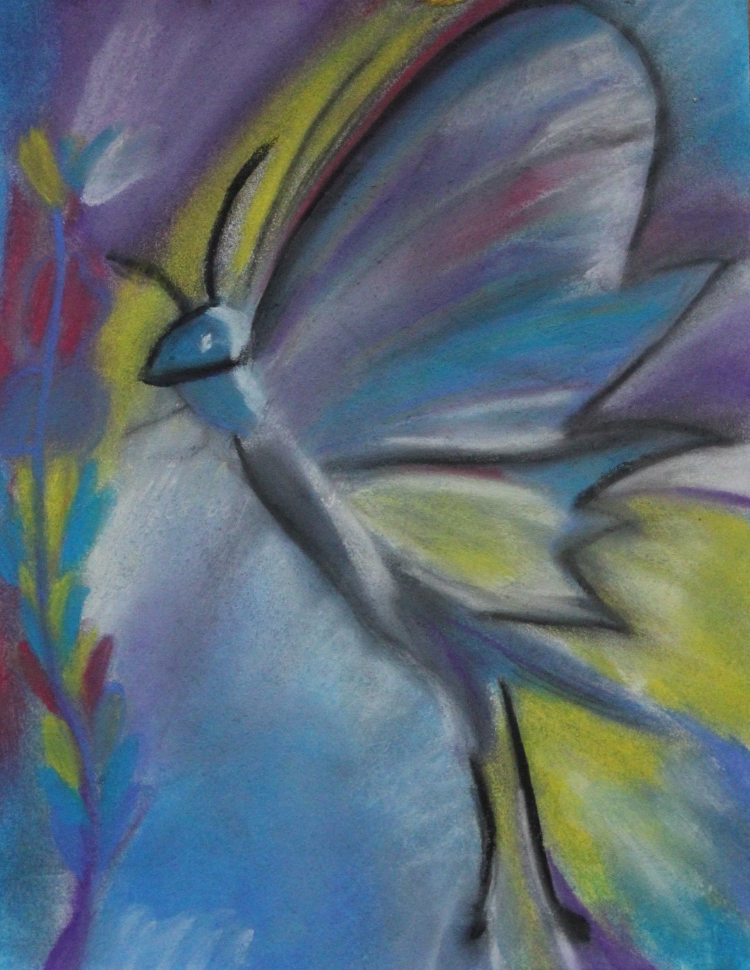 Praca plastyczna przedstawiająca motyla malowana pastelami suchymi.